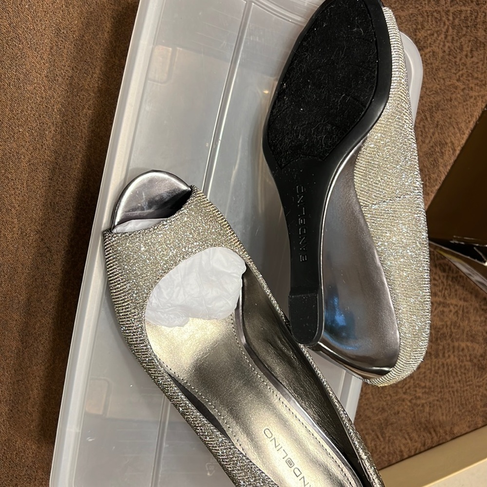 im selling these sparkly silver heels